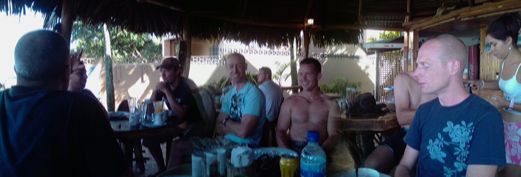 Photo of some handsome chaps at a beach front restaurant