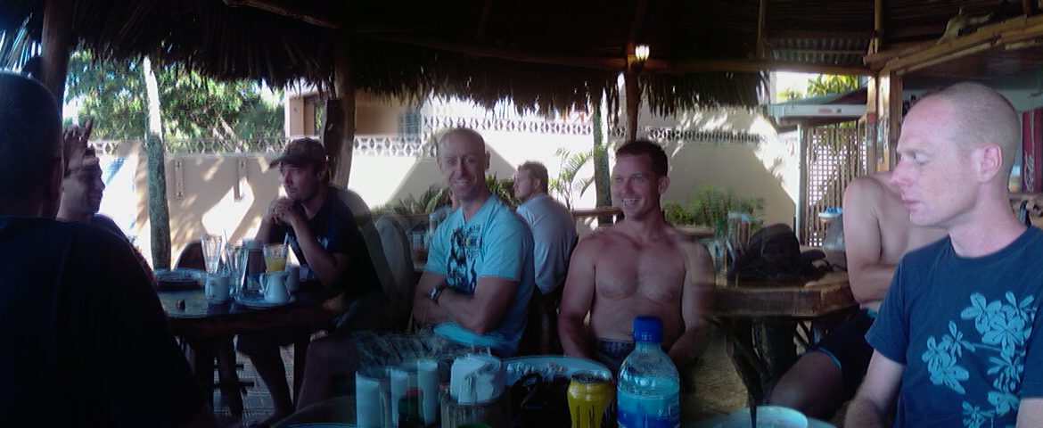 Photo of some handsome chaps at a beach front restaurant